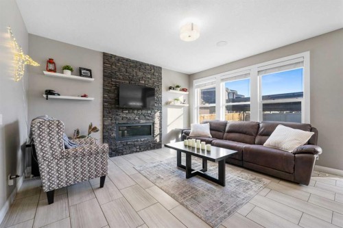 235 Redstone Heights Ne, Calgary, AB - Indoor Photo Showing Living Room With Fireplace