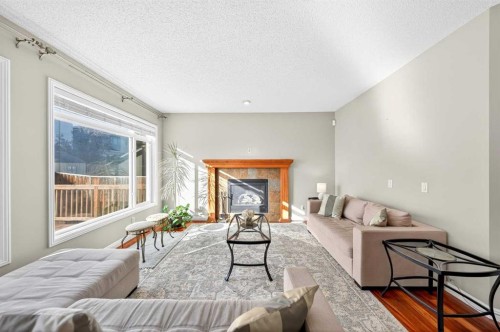 21 Panamount Street Nw, Calgary, AB - Indoor Photo Showing Living Room With Fireplace