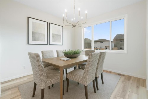 680 Buffaloberry Manor Se, Calgary, AB - Indoor Photo Showing Dining Room