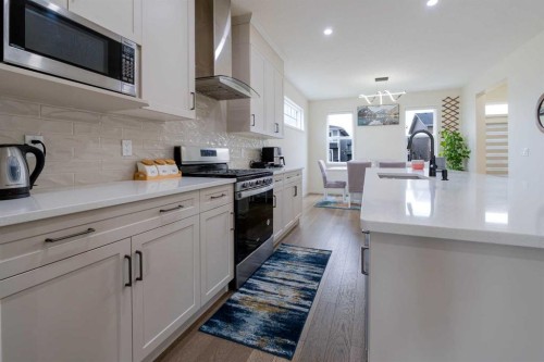 117 Midtown Close Sw, Airdrie, AB - Indoor Photo Showing Kitchen With Upgraded Kitchen