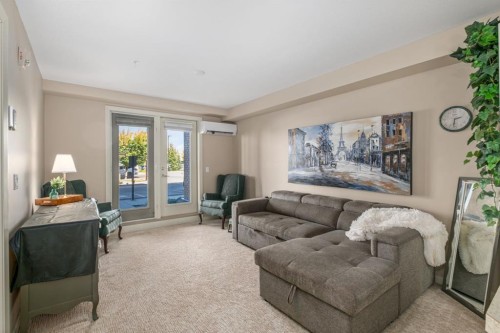 2101-10 Market Boulevard Se, Airdrie, AB - Indoor Photo Showing Living Room