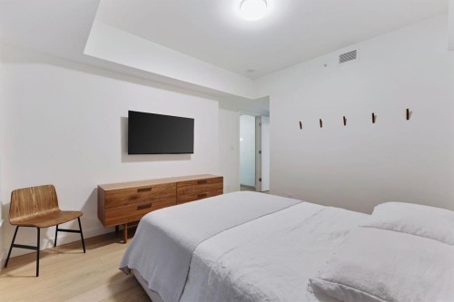 104-128 Waterfront Court Sw, Calgary, AB - Indoor Photo Showing Bedroom