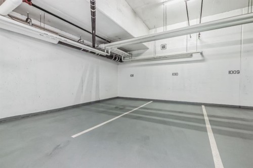 104-128 Waterfront Court Sw, Calgary, AB - Indoor Photo Showing Garage