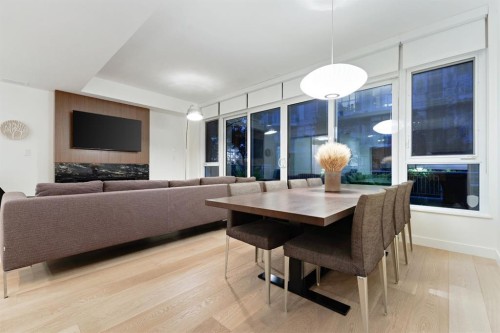104-128 Waterfront Court Sw, Calgary, AB - Indoor With Fireplace