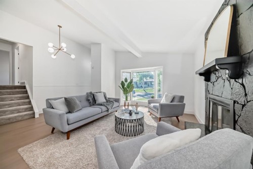 129 Glenpatrick Drive Sw, Calgary, AB - Indoor Photo Showing Living Room With Fireplace