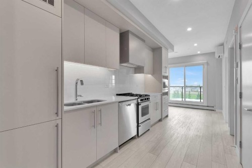 516-8230 Broadcast Avenue Sw, Calgary, AB - Indoor Photo Showing Kitchen With Upgraded Kitchen