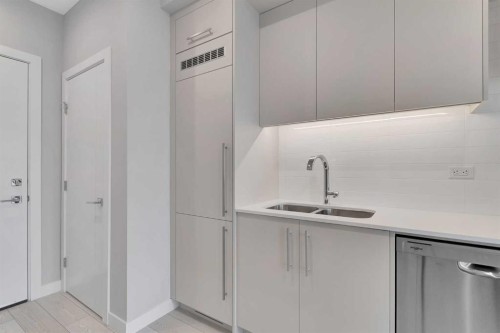 516-8230 Broadcast Avenue Sw, Calgary, AB - Indoor Photo Showing Kitchen With Double Sink