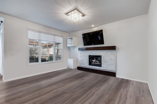 425 Auburn Bay Drive Se, Calgary, AB - Indoor Photo Showing Living Room With Fireplace