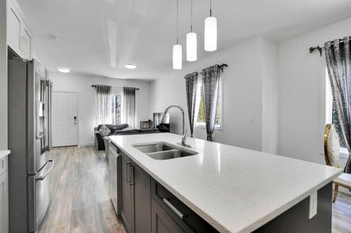 457 Canals Crossing Sw, Airdrie, AB - Indoor Photo Showing Kitchen With Double Sink