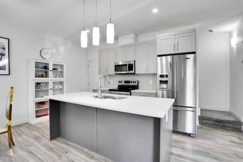 457 Canals Crossing Sw, Airdrie, AB - Indoor Photo Showing Kitchen With Stainless Steel Kitchen With Double Sink With Upgraded Kitchen