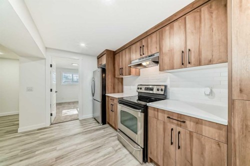 946 Berkley Drive Nw, Calgary, AB - Indoor Photo Showing Kitchen With Stainless Steel Kitchen
