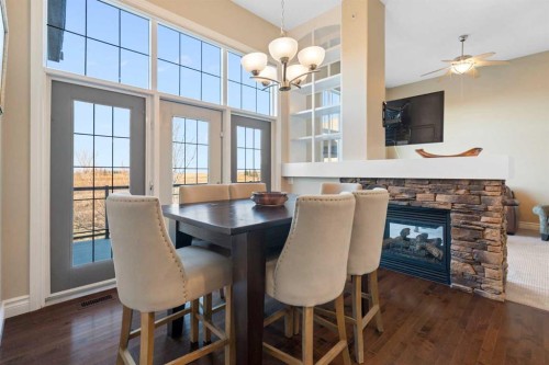 70 Muirfield Boulevard, Lyalta, AB - Indoor Photo Showing Dining Room With Fireplace