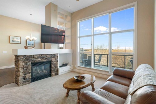 70 Muirfield Boulevard, Lyalta, AB - Indoor Photo Showing Living Room With Fireplace
