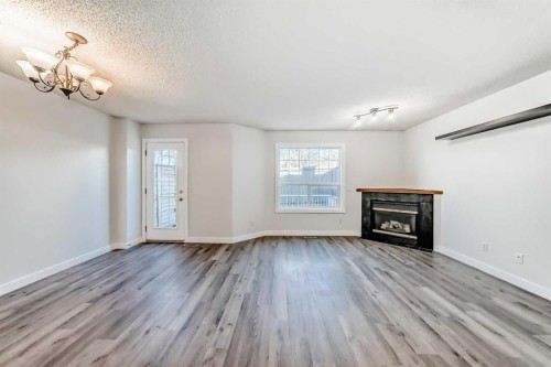 184 Mt Aberdeen Manor Se, Calgary, AB - Indoor Photo Showing Living Room With Fireplace