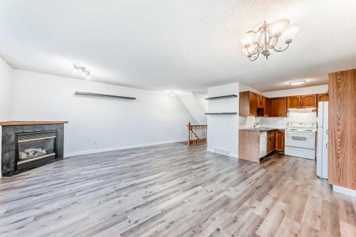 184 Mt Aberdeen Manor Se, Calgary, AB - Indoor Photo Showing Kitchen With Fireplace