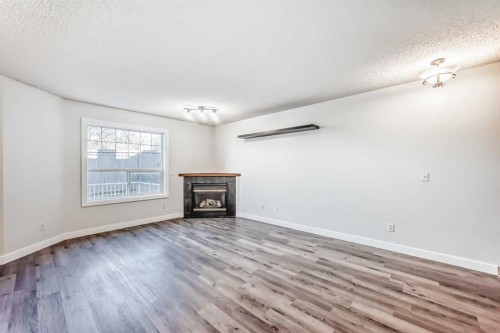 184 Mt Aberdeen Manor Se, Calgary, AB - Indoor Photo Showing Living Room With Fireplace