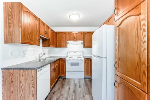 184 Mt Aberdeen Manor Se, Calgary, AB - Indoor Photo Showing Kitchen With Double Sink