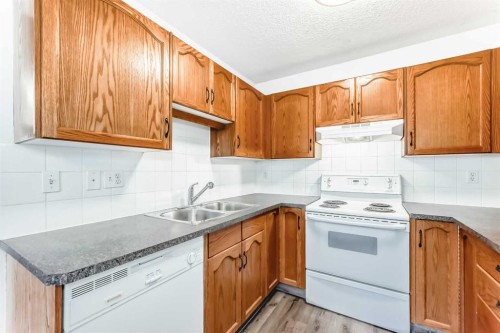 184 Mt Aberdeen Manor Se, Calgary, AB - Indoor Photo Showing Kitchen With Double Sink