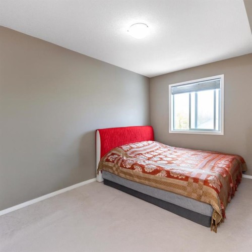 203-5 Saddlestone Way Ne, Calgary, AB - Indoor Photo Showing Bedroom