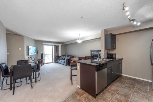 203-5 Saddlestone Way Ne, Calgary, AB - Indoor Photo Showing Kitchen With Double Sink