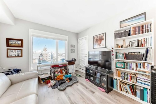 403-200 Shawnee Square Sw, Calgary, AB - Indoor Photo Showing Living Room