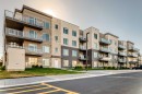 403-200 Shawnee Square Sw, Calgary, AB  - Outdoor With Balcony With Facade 
