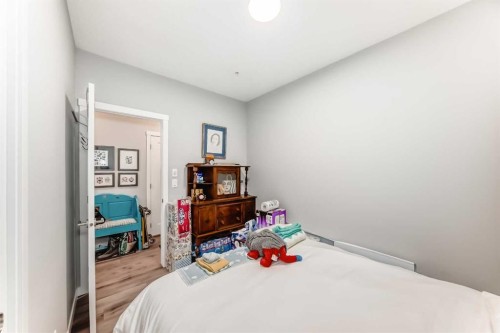 403-200 Shawnee Square Sw, Calgary, AB - Indoor Photo Showing Bedroom