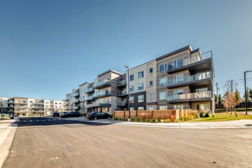 403-200 Shawnee Square Sw, Calgary, AB - Outdoor With Balcony With Facade