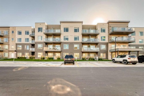 403-200 Shawnee Square Sw, Calgary, AB - Outdoor With Balcony With Facade