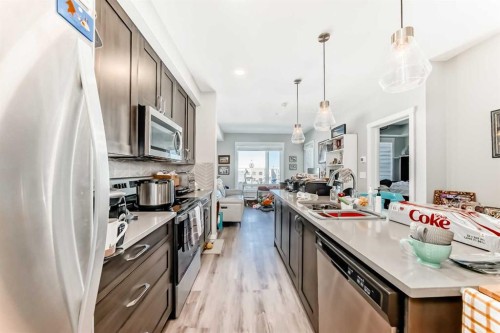 403-200 Shawnee Square Sw, Calgary, AB - Indoor Photo Showing Kitchen With Upgraded Kitchen