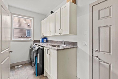 269 Kinniburgh Boulevard, Chestermere, AB - Indoor Photo Showing Laundry Room