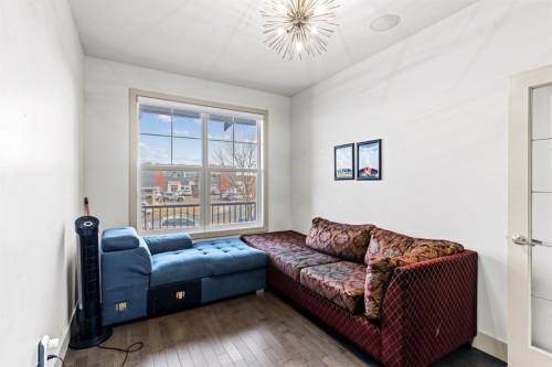 269 Kinniburgh Boulevard, Chestermere, AB - Indoor Photo Showing Living Room