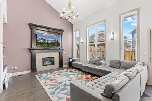 269 Kinniburgh Boulevard, Chestermere, AB - Indoor Photo Showing Living Room With Fireplace