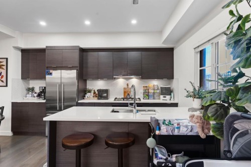 101-1818 14A Street Sw, Calgary, AB - Indoor Photo Showing Kitchen With Stainless Steel Kitchen With Double Sink With Upgraded Kitchen
