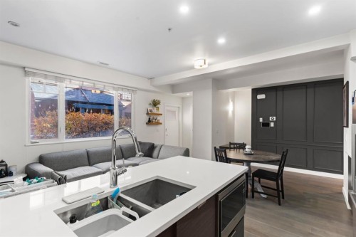 101-1818 14A Street Sw, Calgary, AB - Indoor Photo Showing Kitchen With Double Sink