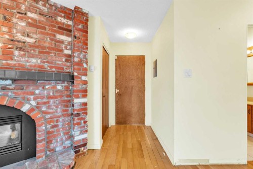 301-508 Cedar Crescent Sw, Calgary, AB - Indoor Photo Showing Other Room With Fireplace