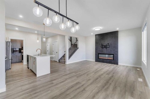 592 Savanna Crescent Ne, Calgary, AB - Indoor Photo Showing Other Room With Fireplace