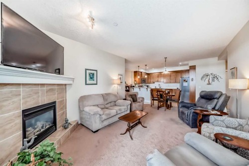 207-1005B Westmount Drive, Strathmore, AB - Indoor Photo Showing Living Room With Fireplace