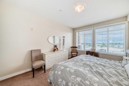 207-1005B Westmount Drive, Strathmore, AB - Indoor Photo Showing Bedroom