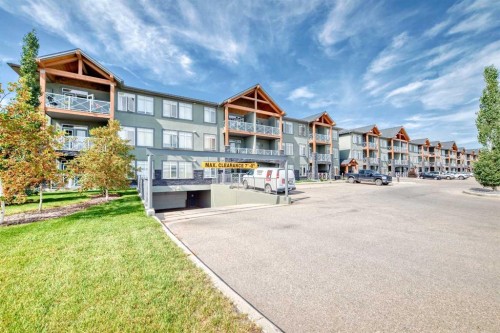 207-1005B Westmount Drive, Strathmore, AB - Outdoor With Balcony With Facade