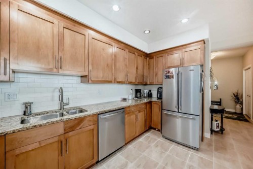207-1005B Westmount Drive, Strathmore, AB - Indoor Photo Showing Kitchen With Double Sink
