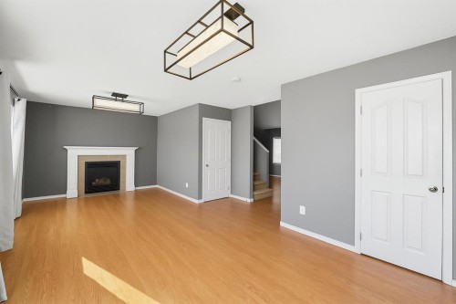 824 Luxstone Square Sw, Airdrie, AB - Indoor With Fireplace
