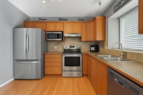 824 Luxstone Square Sw, Airdrie, AB - Indoor Photo Showing Kitchen With Double Sink