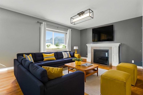 824 Luxstone Square Sw, Airdrie, AB - Indoor Photo Showing Living Room With Fireplace