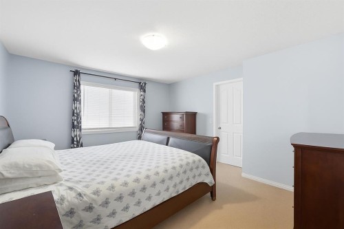 824 Luxstone Square Sw, Airdrie, AB - Indoor Photo Showing Bedroom