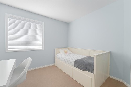 824 Luxstone Square Sw, Airdrie, AB - Indoor Photo Showing Bedroom