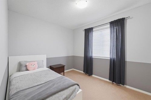 824 Luxstone Square Sw, Airdrie, AB - Indoor Photo Showing Bedroom