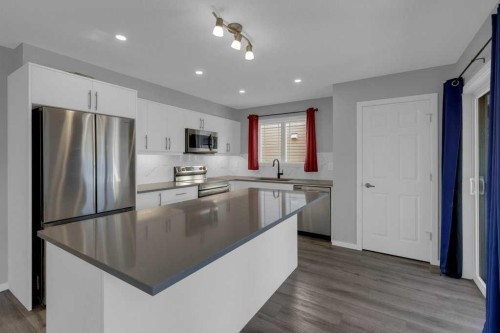 827 Windbury Street Sw, Airdrie, AB - Indoor Photo Showing Kitchen With Upgraded Kitchen