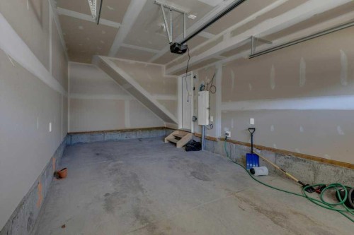 827 Windbury Street Sw, Airdrie, AB - Indoor Photo Showing Garage
