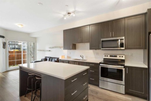 1106-298 Sage Meadows Park Nw, Calgary, AB - Indoor Photo Showing Kitchen With Stainless Steel Kitchen